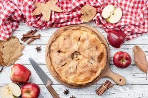 Homemade apple pie with fresh red apples photo