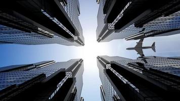 Jet Plane Flying over Skyscrapers in Business District Area -  View from Below video