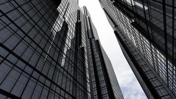 Airplane Flying over Skyscrapers, Office Buildings in Business District - View from Below video