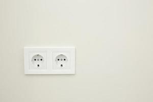 White double socket on white background.Electric plug. European high voltage 220W sockets.High resolution photo. photo