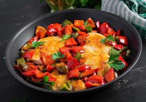 Grilled chicken fillets and sweet pepper on grill iron pan. photo