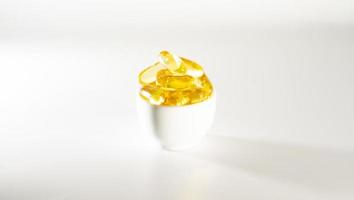 Vitamin D, omega 3, omega 6, Food supplement oil filled fish oil, vitamin A, vitamin E, flaxseed oil. photo