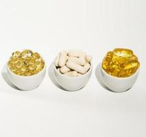 Vitamin D, omega 3, omega 6, Food supplement oil filled fish oil, vitamin A, vitamin E, flaxseed oil. photo