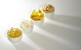 Vitamin D, omega 3, omega 6, Food supplement oil filled fish oil, vitamin A, vitamin E, flaxseed oil. photo