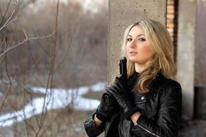 Cute girl in leather jacket photo