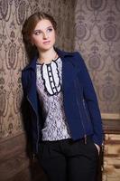 Young woman in blue jacket photo