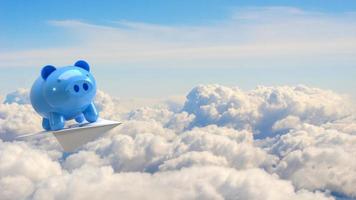 The blue piggy bank on paper plane in sky for earn or save concept 3d rendering photo