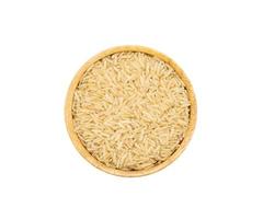 Uncooked dry Jasmine rice in wooden bowl on white background, top view photo