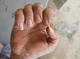dirty asian man fingernails of a mechanic photo