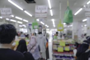 Abstract blurred of isle interior in a market, with bokeh light background. photo