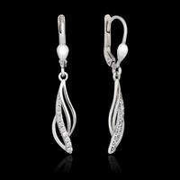 White gold earrings with diamond isolated on the black background photo