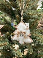 Zero waste. Eco Christmas tree decor toy - wooden pendant is decorated with fur, ribbon and bell, without plastic. Perfect content for advertising banner, gift card or creative projects.