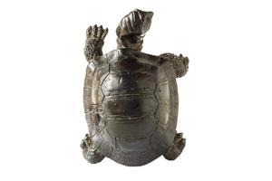 Black figurine of a turtle on a white background, top view. photo