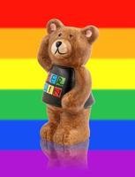 el oso es el símbolo de la ciudad de berlín. oso en el fondo de la bandera del arco iris. foto
