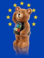 The bear is the symbol of the city of Berlin. Bear on the background of the flag of Europe. photo