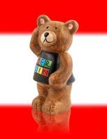 The bear is the symbol of the city of Berlin. Bear on the background of the flag of the city of Berlin. photo