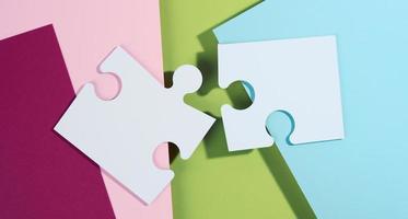 large blank white paper puzzle with shadow, top view. Abstract creative backdrop for designer photo