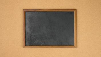 empty rectangular brown wooden frame on a brown background photo