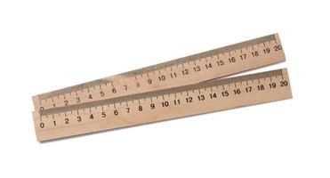Wooden school ruler isolated on white background photo