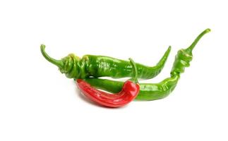 fresh pods of hot pepper on a white background. photo