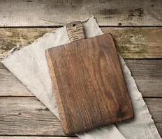 empty rectangular wooden cutting kitchen board on table photo