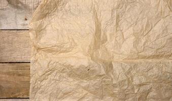 crumpled blank sheet of brown wrapping kraft paper, vintage texture for the designer photo