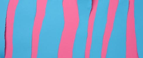 torn blue stripes on pink background, abstract background photo