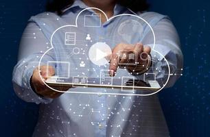 Cloud data storage and a woman holding an electronic tablet. Information exchange and secure data storage. Cloud server and high technology photo