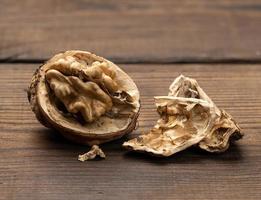 broken walnut on brown wooden table photo