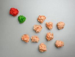 crumpled sheets of colored paper on a gray background. Solution concept photo