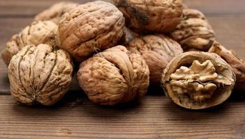 walnut on brown wooden table, close up photo