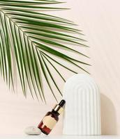 brown glass bottle with a pipette and a brown label stands on a stone. Container for cosmetics, serum and oil. photo