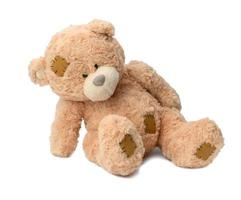 Brown teddy bear on a white background photo