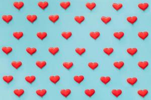 Red heart on blue background for Valentine day photo