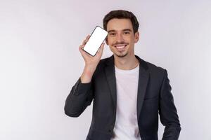 Portrait of young businessman holding smartphone cellphone blank screen with mockup copy space isolated white background photo