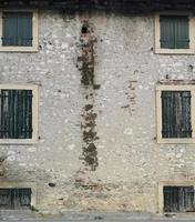 Vintage windows on stone wall photo
