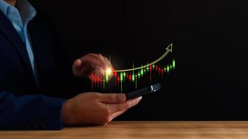Economic analysis concept. Businessman analyze graph growth of business amid the global economic crisis, Strategy and planning, Recovery of business, Analyzing and data exchange on global networking. photo