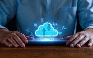 Businessman using cloud technology connect business data. Cloud computing concept idea show on hand. Internet Cloud technology. Digital Data storage. Network and internet service for business concept. photo