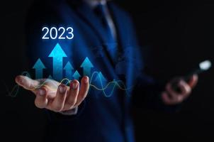 Growth and development chart of company in new year 2023. Planning, long term investment, opportunity, challenge and business strategy in new year 2023. Development to success and motivation. photo