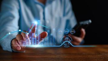 Economic analysis concept. Businessman analyze graph growth of business amid the global economic crisis, Strategy and planning, Recovery of business, Analyzing and data exchange on global networking. photo