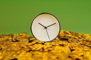 time and gold The idea of saving gold and valuable time. photo