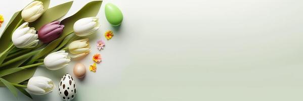 Decorated Tulips and Eggs On a Clean Background for An Easter Celebration Banner photo