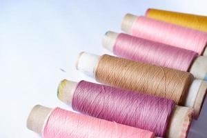 various colors of sewing thread photo