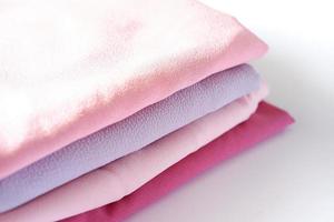 various beautiful and attractive fabrics folded neatly photo