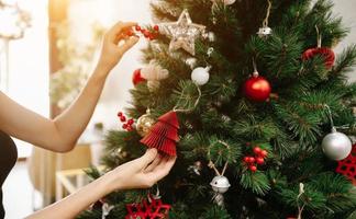 Merry Christmas Decorated Christmas tree on blurred background. photo