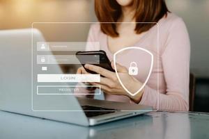 Cyber security concept, Login, User, identification information security and encryption, secure access to user's personal information woman using smart phone and tablet in office photo