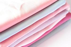 various beautiful and attractive fabrics folded neatly photo