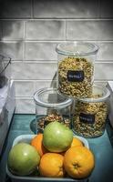 Muesli and some fruit in the kitchen ready for preparing a healthy breakfast photo