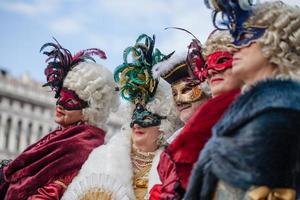 Venice, Italy - February, 2019 Carnival of Venice, typical Italian tradition and festivity with masks photo