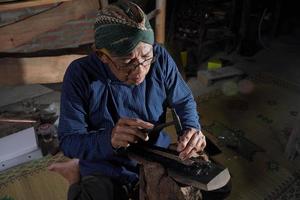 Keris craftsmen in the workshop, in the process of making keris. Bantul, Indonesia - 25 August 2022 photo